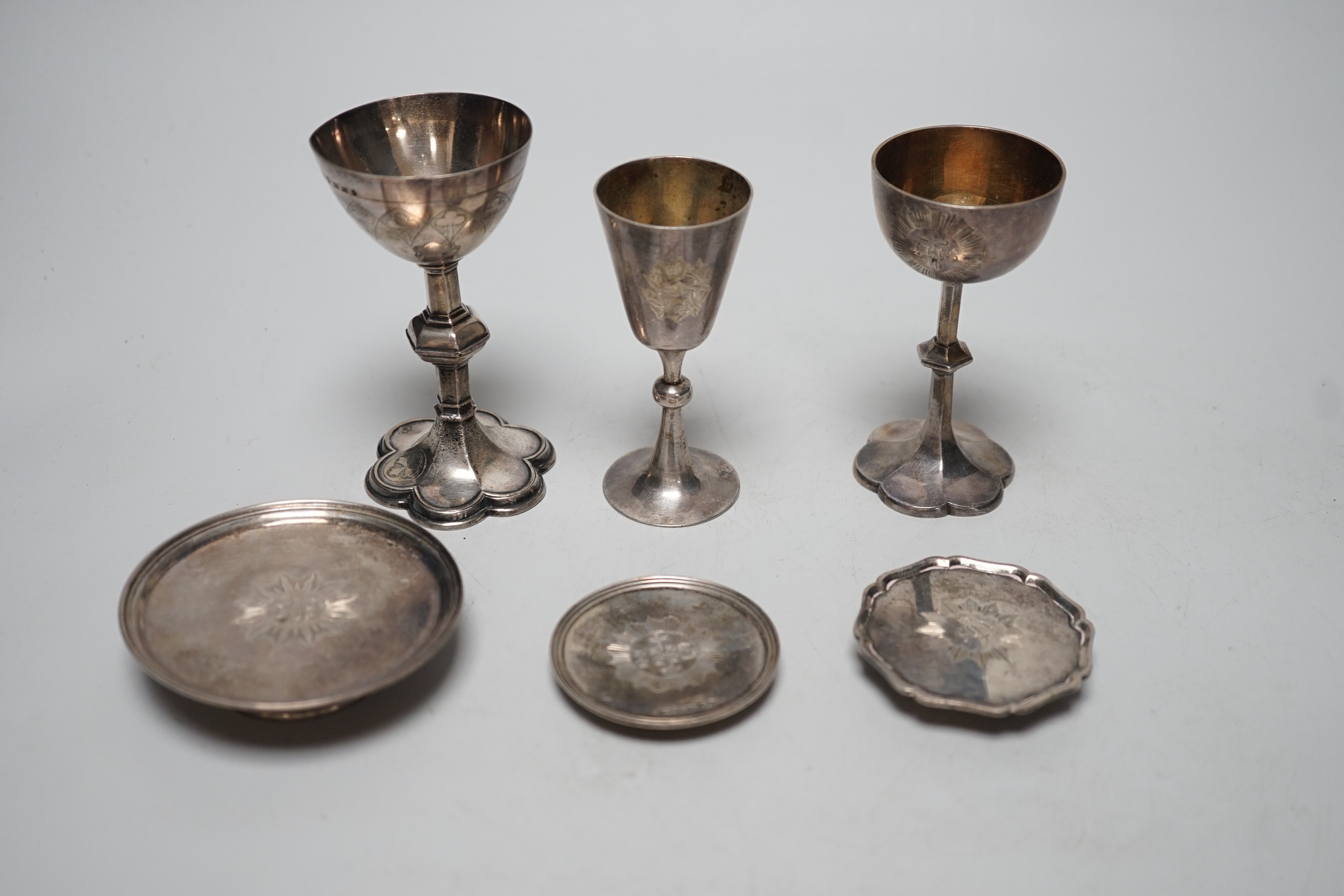 Three Victorian silver communion chalices, largest Thomas Thomason & Co, Birmingham, 1867, 10.1cm, Rawlings & Summers, London, 1854 and Josiah Williams & Co, London, 1889, together with three Victorian silver patens, lar